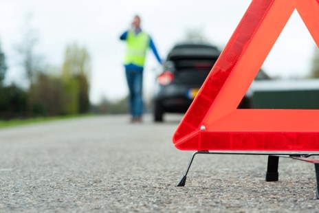 Person places emergency triangle 45 metres behind the vehicle.