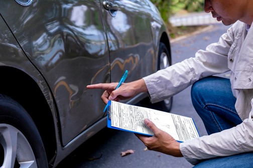 An accident-damaged vehicle is assessed