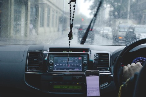 Man drving through heavy rain with low visibility